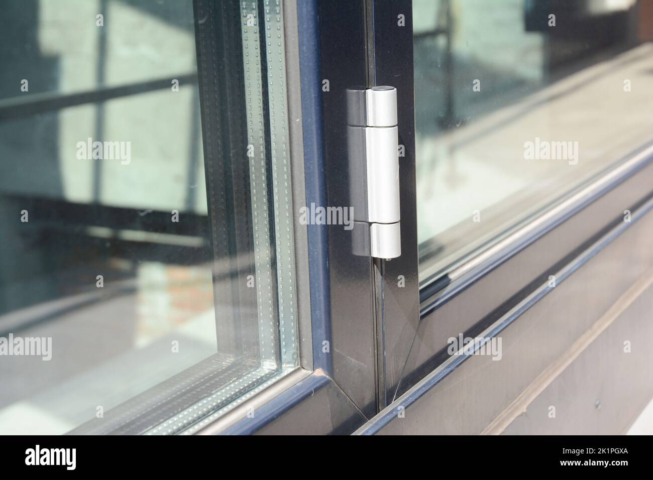 Close up on conservatory glass door door hinge Stock Photo