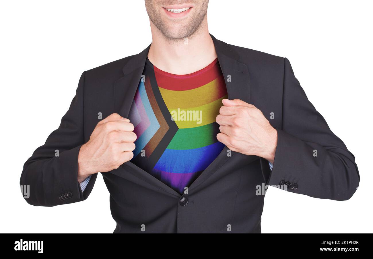 Businessman showing shirt with the progress LGBTQ Rainbow flag Stock Photo