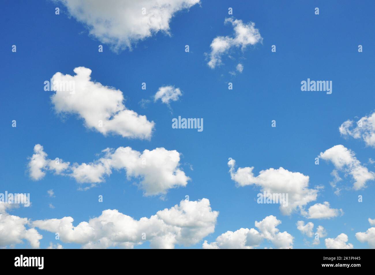 Fluffy clouds on summer blue sky Stock Photo