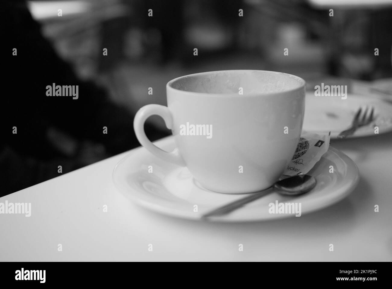 A greyscale shot of a coffee cup Stock Photo