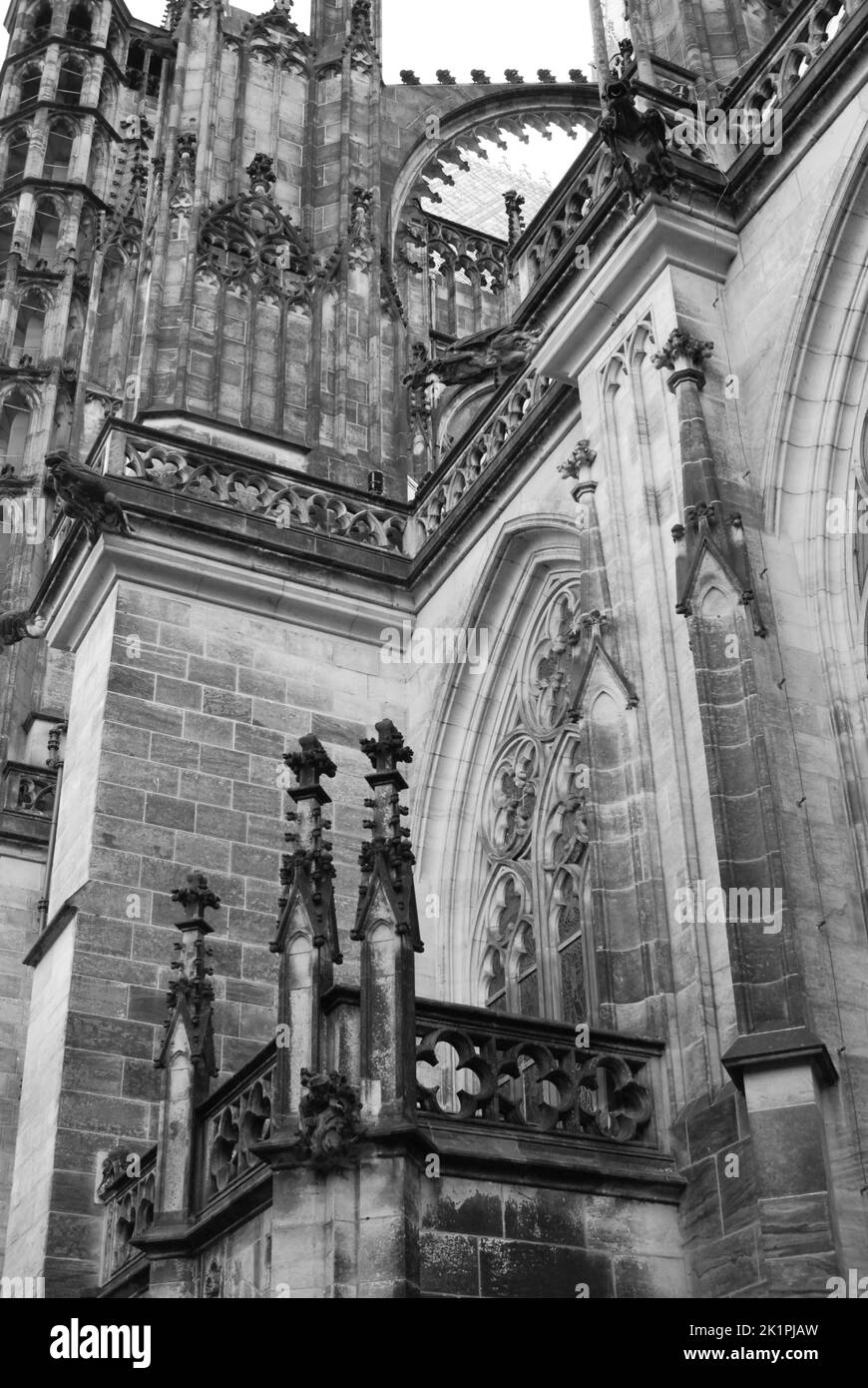 A vertical greyscale shot of the St. Vitus Cathedral at Prague Castle in Prague, Czech Republic Stock Photo