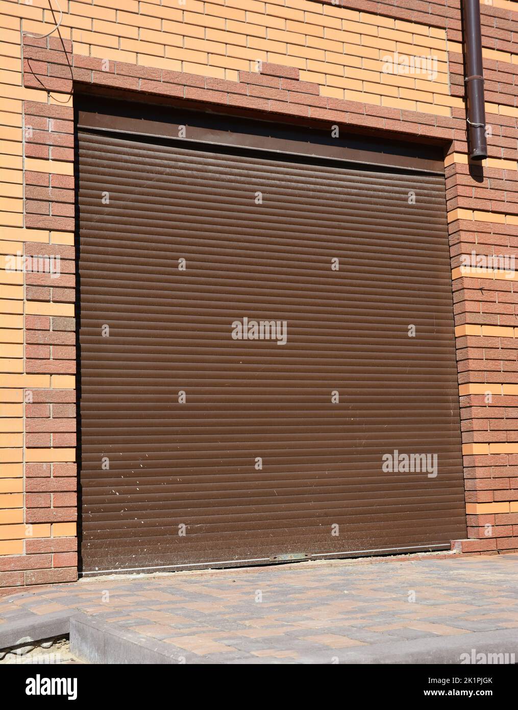 Metal roller shutter installation for house entance protection Stock Photo