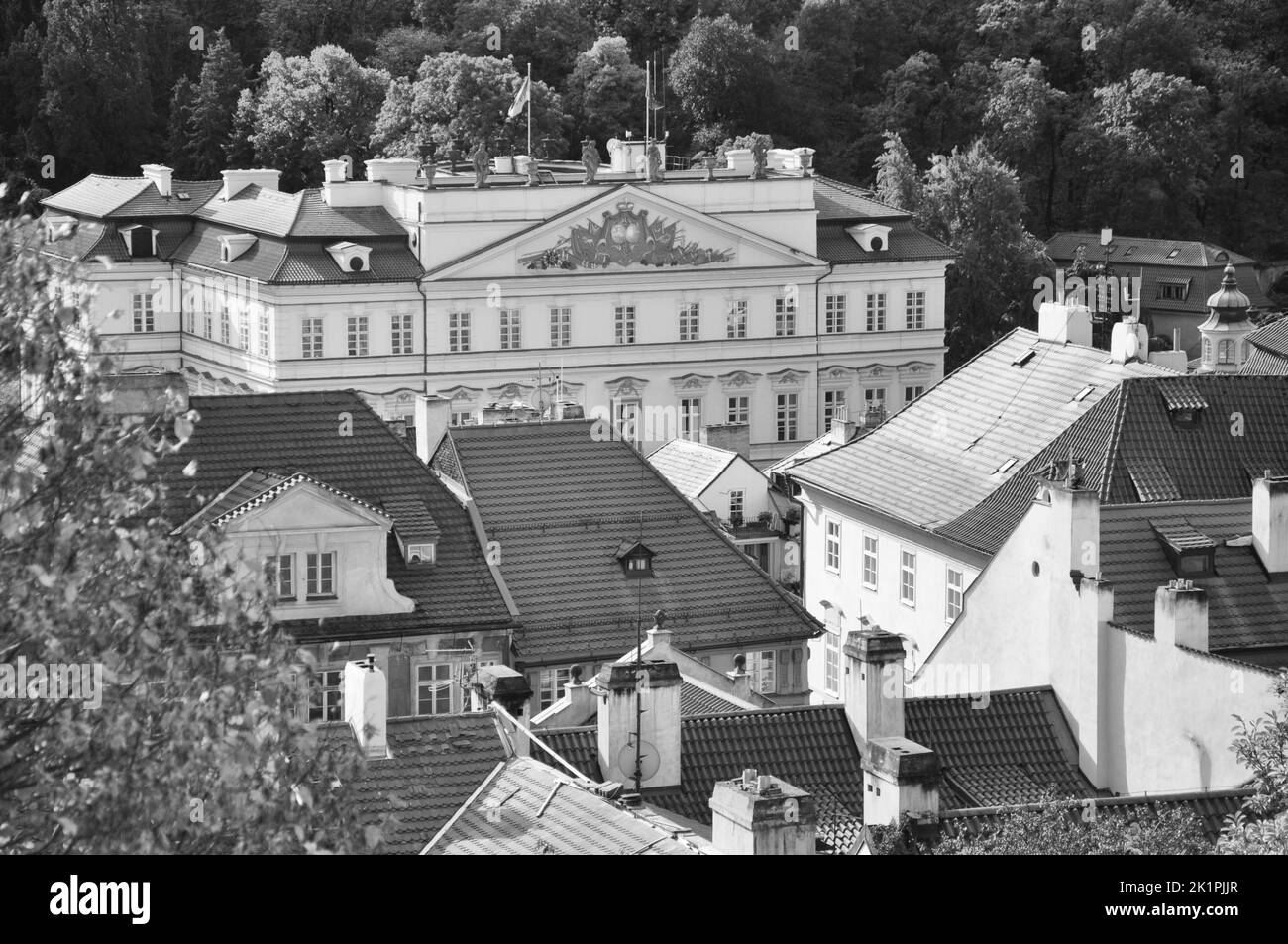 A greyscale view on and over the roofs of Prague Old Town in Prague, Czech Republic Stock Photo