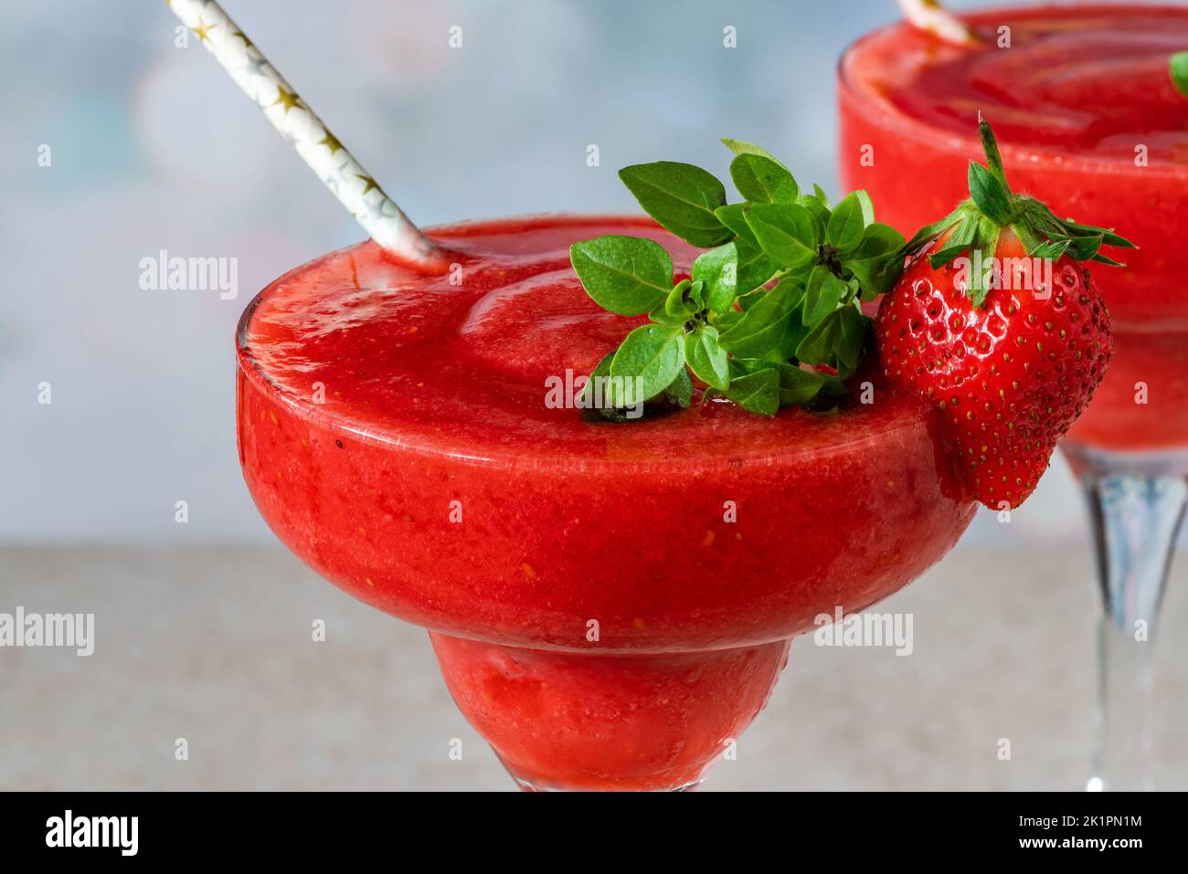 Frozen strawberry daiquiri with white rum garnished with fresh fruit