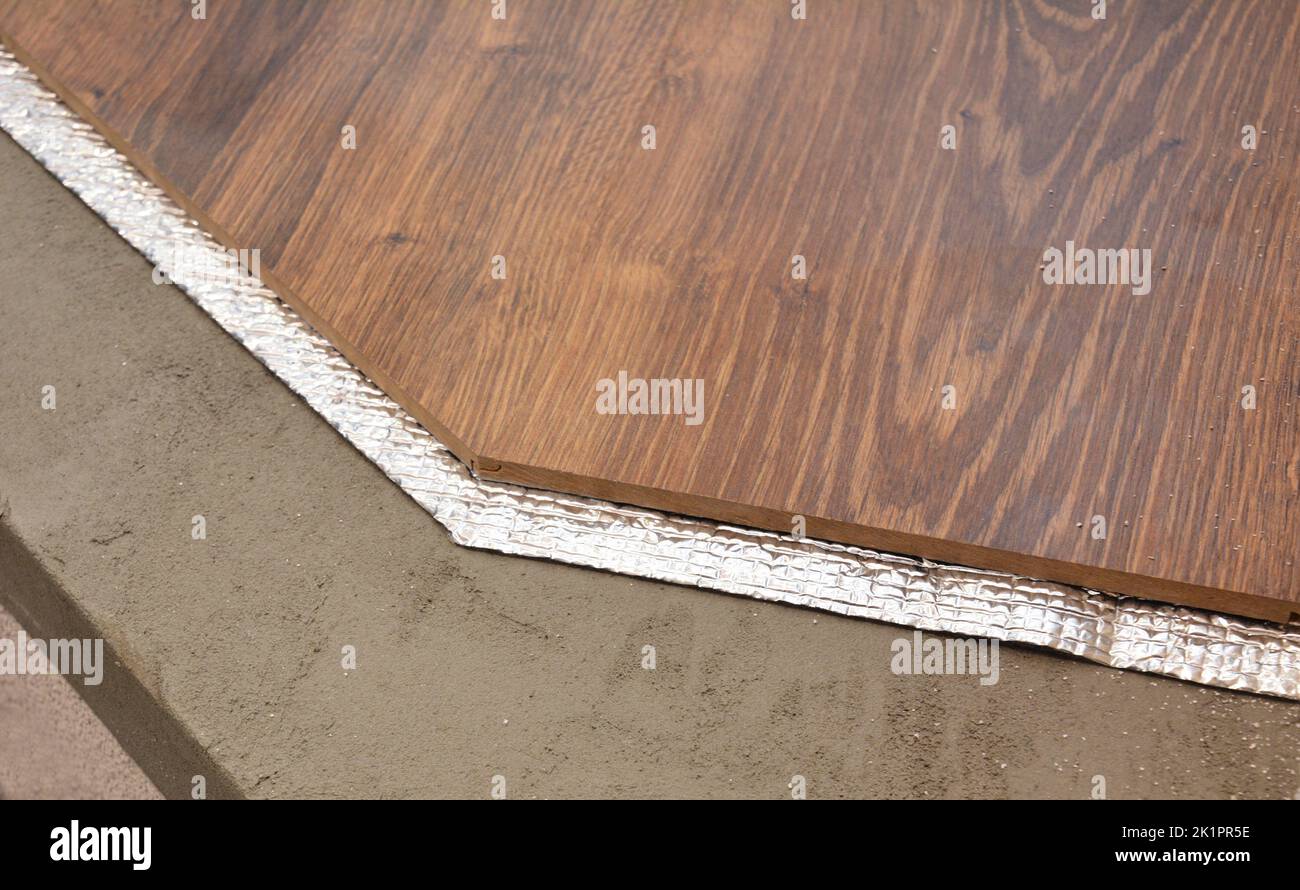 Hardwood floor installation layers with insulation membrane. Flooring