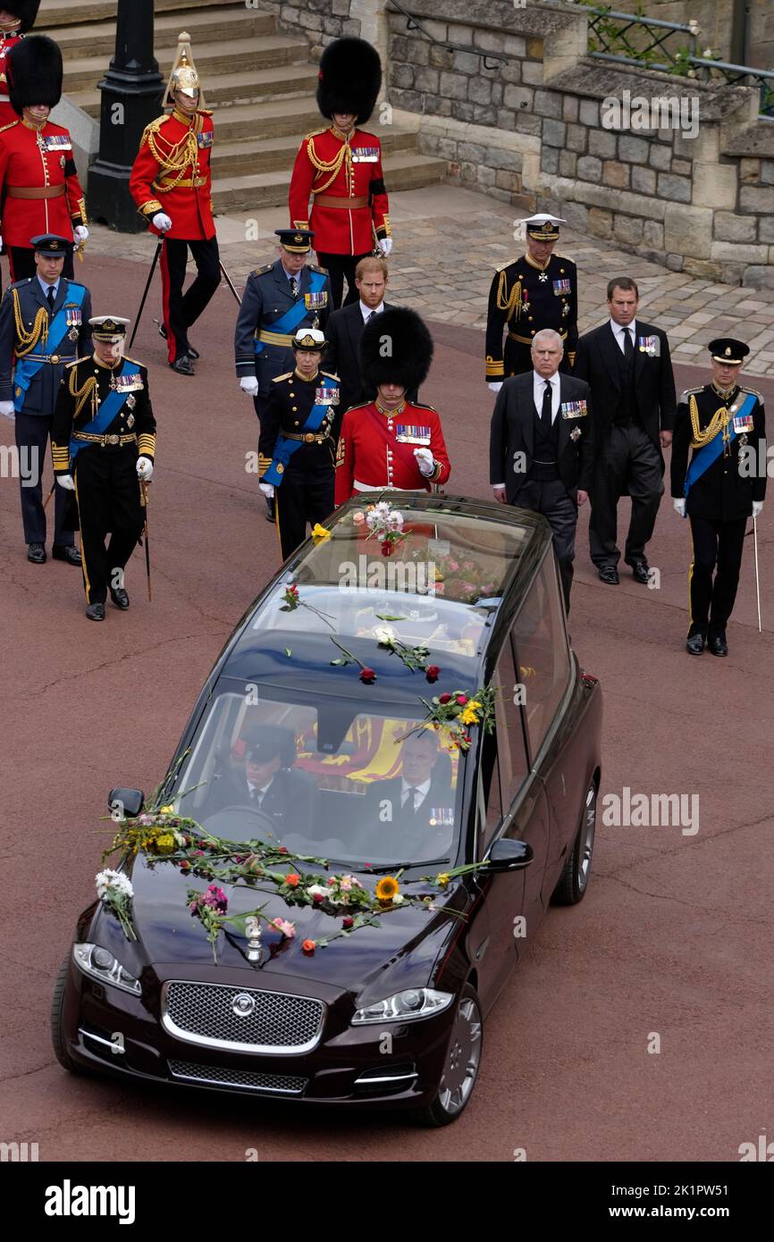 (Left to right) Prince of Wales, King Charles III, Duke of Gloucester, Princess Royal, Duke of Sussex, Duke of York, Vice Admiral Sir Tim Laurence, Peter Phillips and the Earl of Wessex, follow behind the State Hearse carrying the coffin of Queen Elizabeth II, draped in the Royal Standard with the Imperial State Crown and the Sovereign's Orb and Sceptre, to a Committal Service at St George's Chapel in Windsor Castle. Picture date: Monday September 19, 2022. Stock Photo