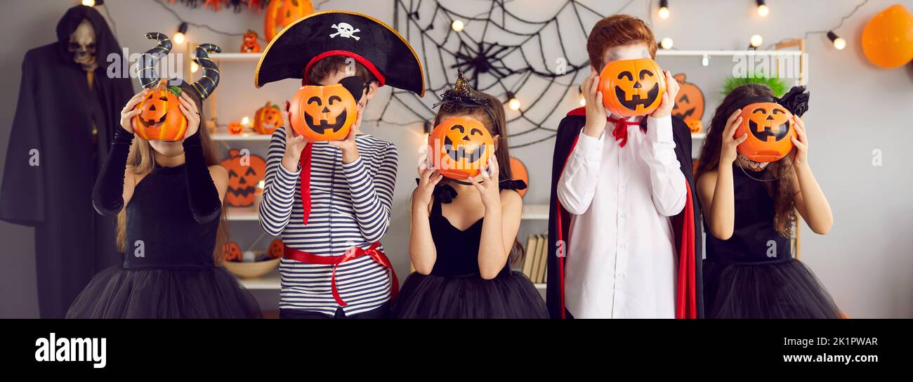 Web banner of children in costumes celebrate Halloween Stock Photo