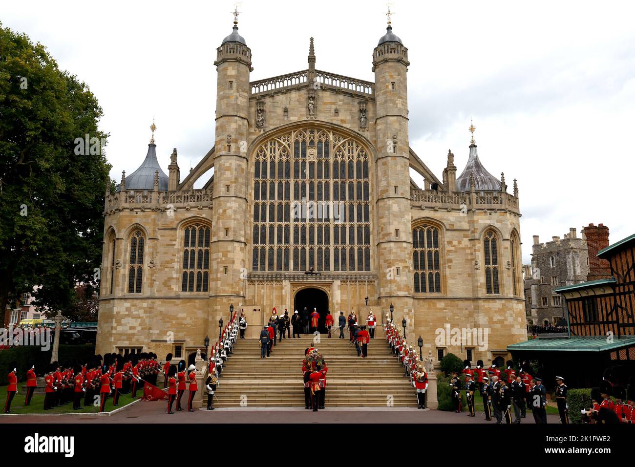 The bearer party from the Queen's Company, 1st Battalion Grenadier Guards carry the coffin of Queen Elizabeth II in to St George's Chapel at Windsor Castle for the Committal Service following the state funeral at Westminster Abbey. Picture date: Monday September 19, 2022. Stock Photo