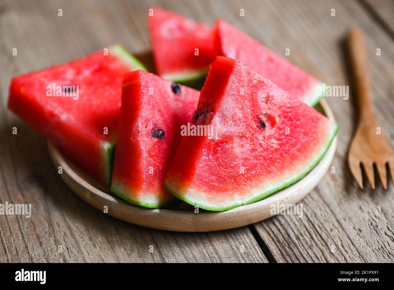 Sweet watermelon slices pieces fresh watermelon tropical summer fruit, Watermelon slice on plate wooden background Stock Photo