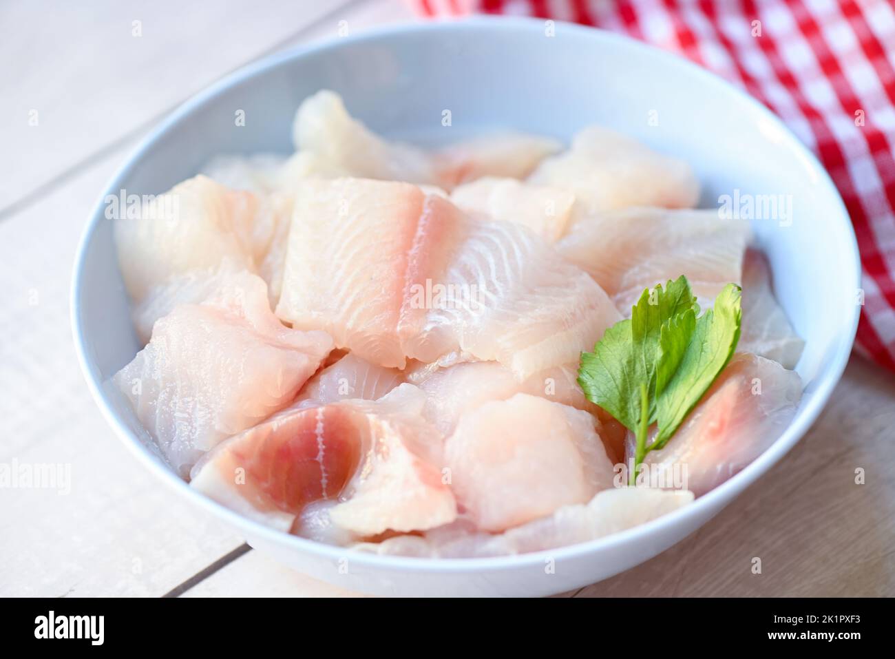 fresh raw pangasius fish fillet with, meat dolly fish tilapia striped catfish, fish fillet on bowl for cooking Stock Photo