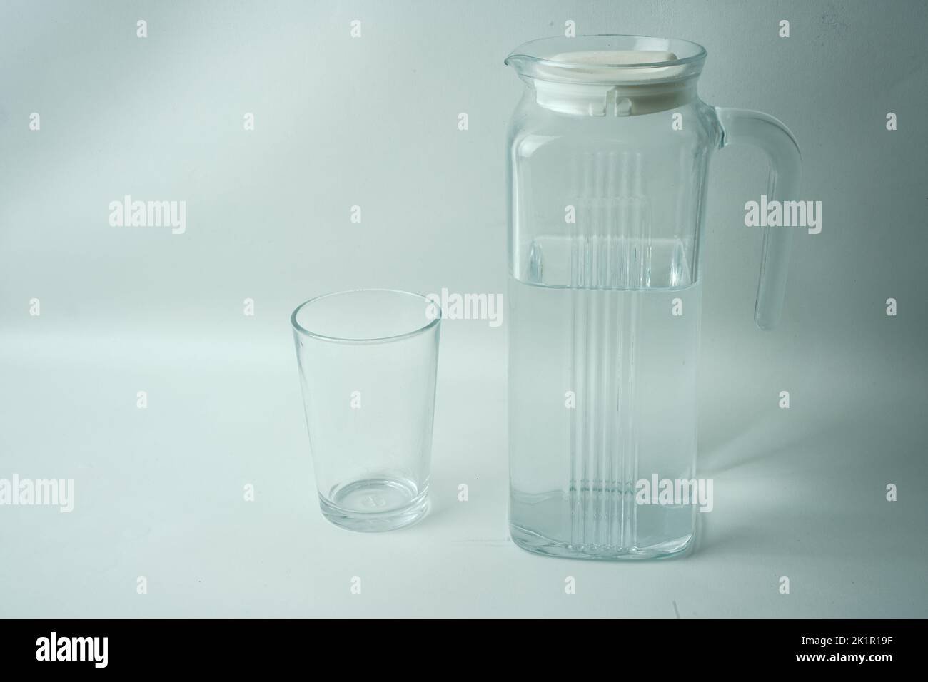 A carafe of clean water and a glass Stock Photo