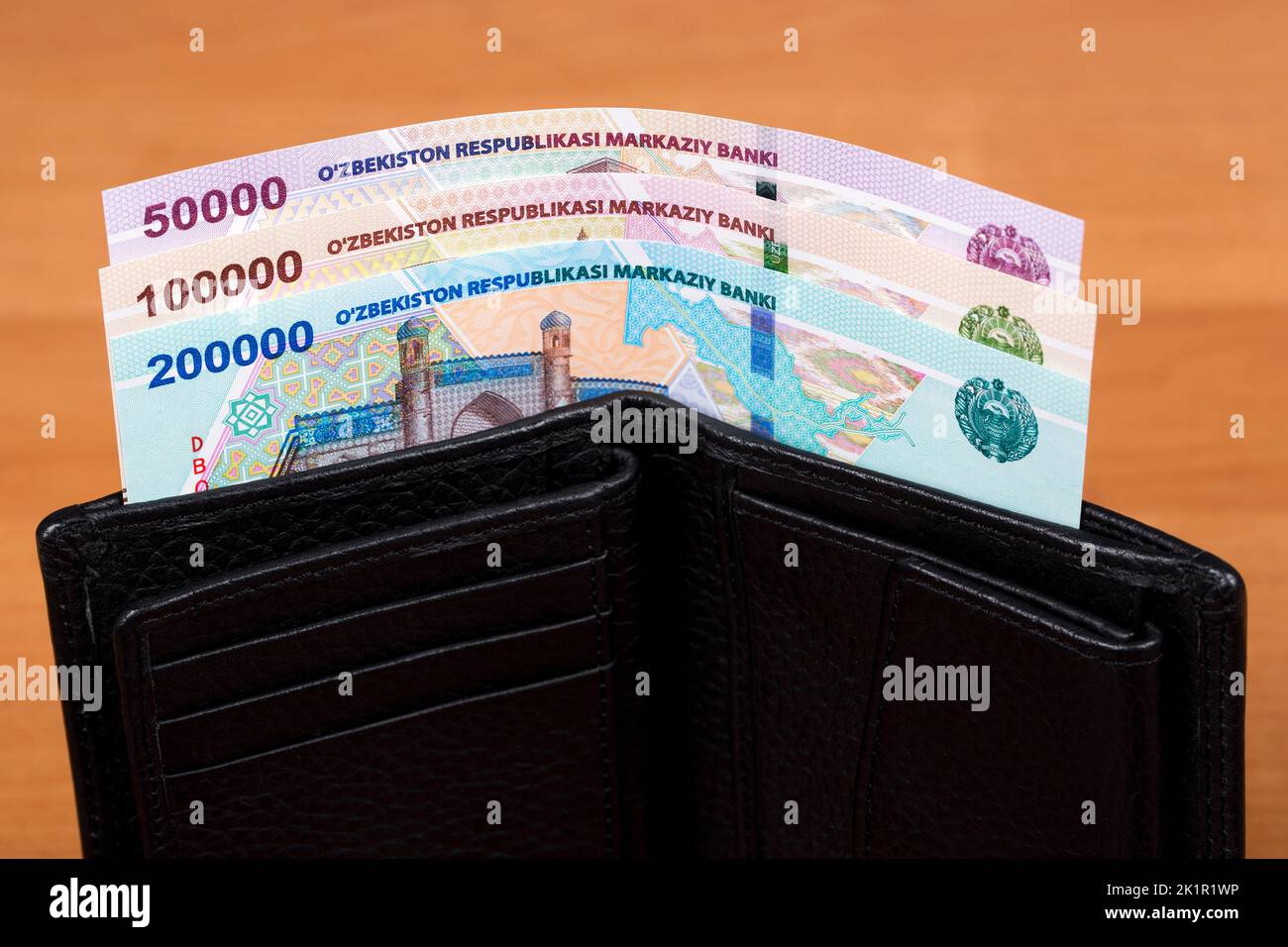 Uzbekistani money - soum in the black wallet Stock Photo
