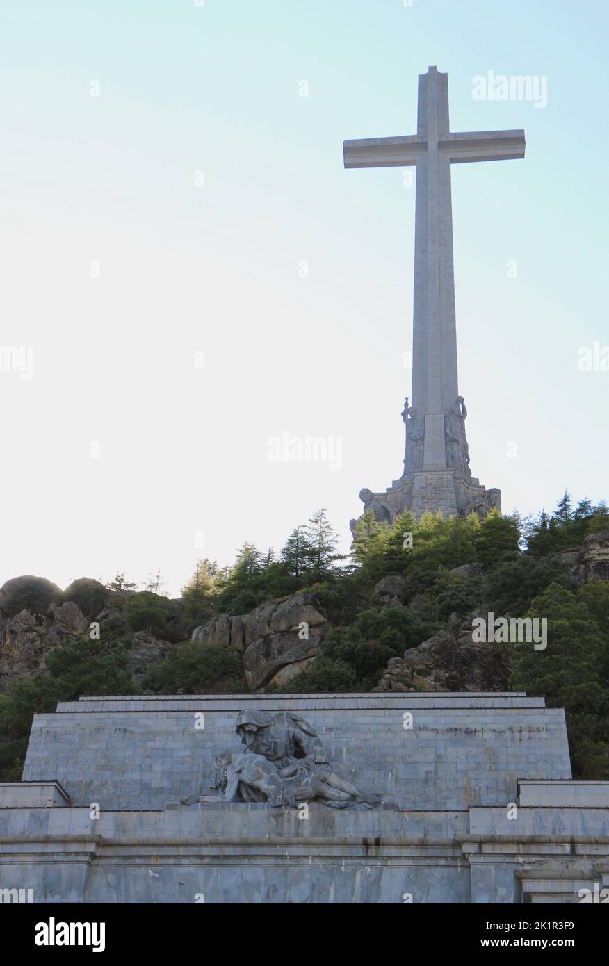 Valle de Los Caidos (Valley of the fallen) Huge cross and statue of Mary holding Jesus in strong sunlight Madrid Spain Stock Photo