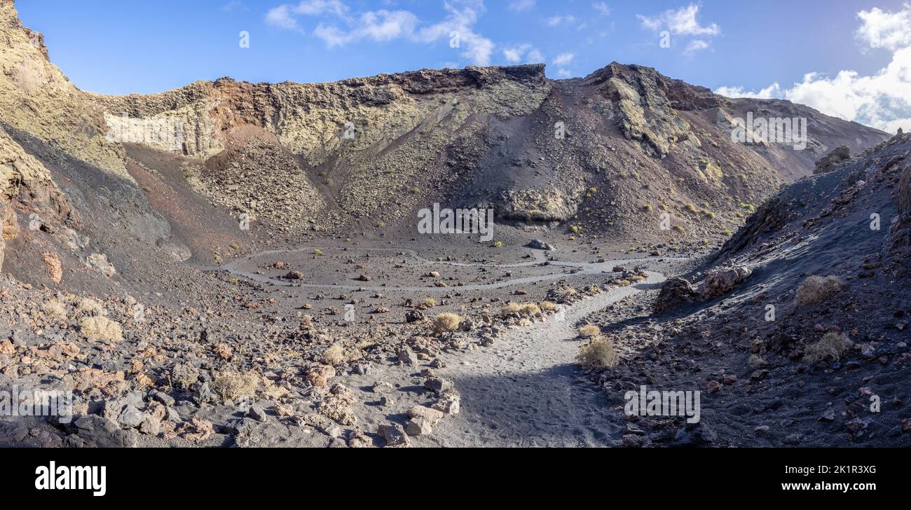 The caldera of the Volcano Montaña del Cuervo with footpath (Lanzarote island, Spain) Stock Photo