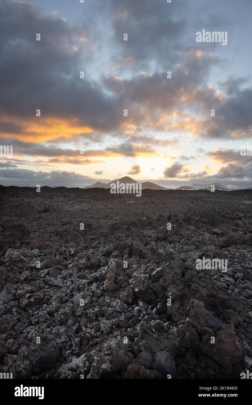 Volcanic landscape near Mancha Blanca on the island of Lanzarote at sunrise. Stock Photo