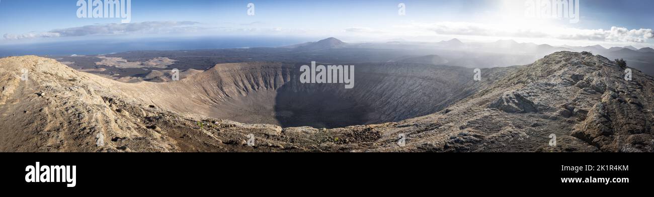 Panoramic image of the crater Caldera Blanca on early morning shot from the highest point Pico de la Caldera Blanca. In the background the volcano Mon Stock Photo