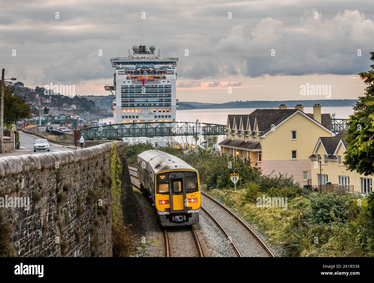 Cobh, Cork, Ireland. 20th September, 2022.  Cruise ship Emerald Princess is berthed overnight at the deep water quay as an early morning commuter train from Kent Station nears her journeys end in Cobh, Co. Cork, Ireland. - Credit; / Alamy Live News Stock Photo