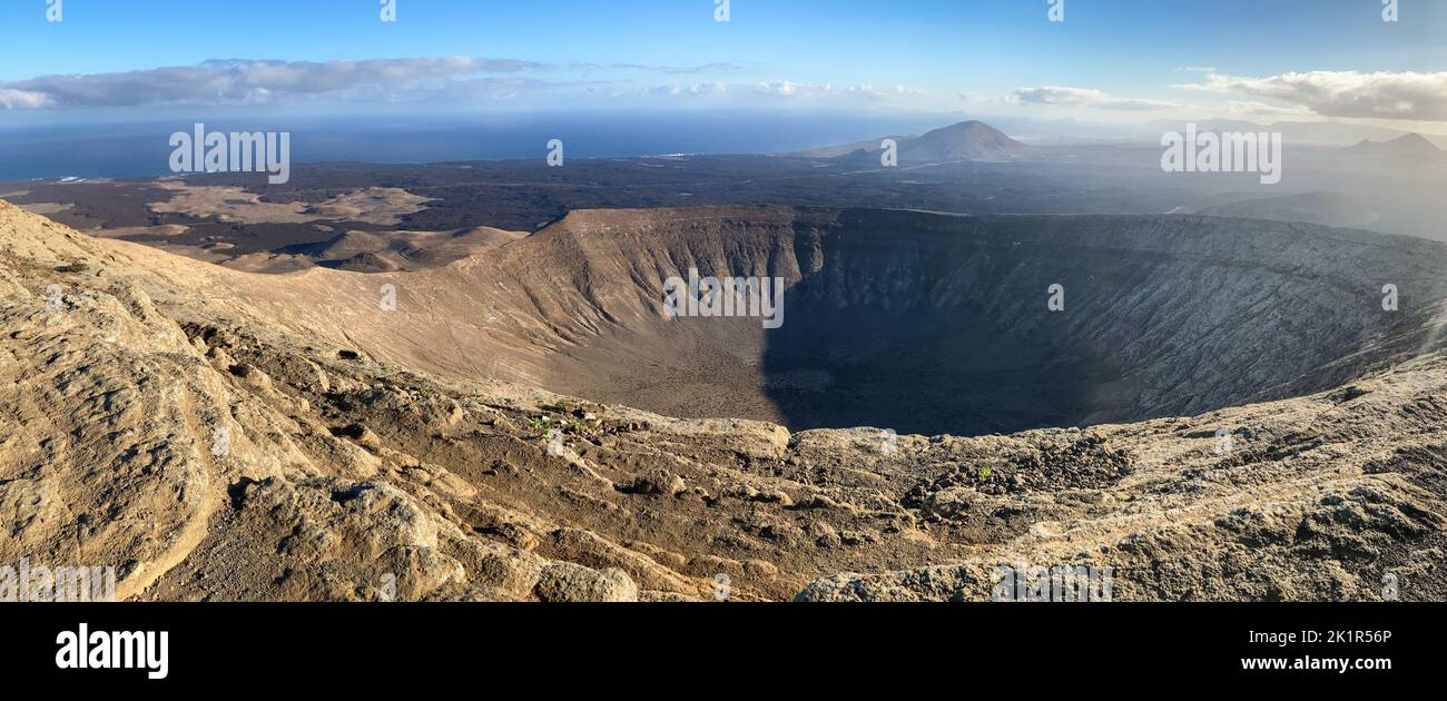Panoramic image of the crater Caldera Blanca on early morning shot from the highest point Pico de la Caldera Blanca. In the background the volcano Mon Stock Photo