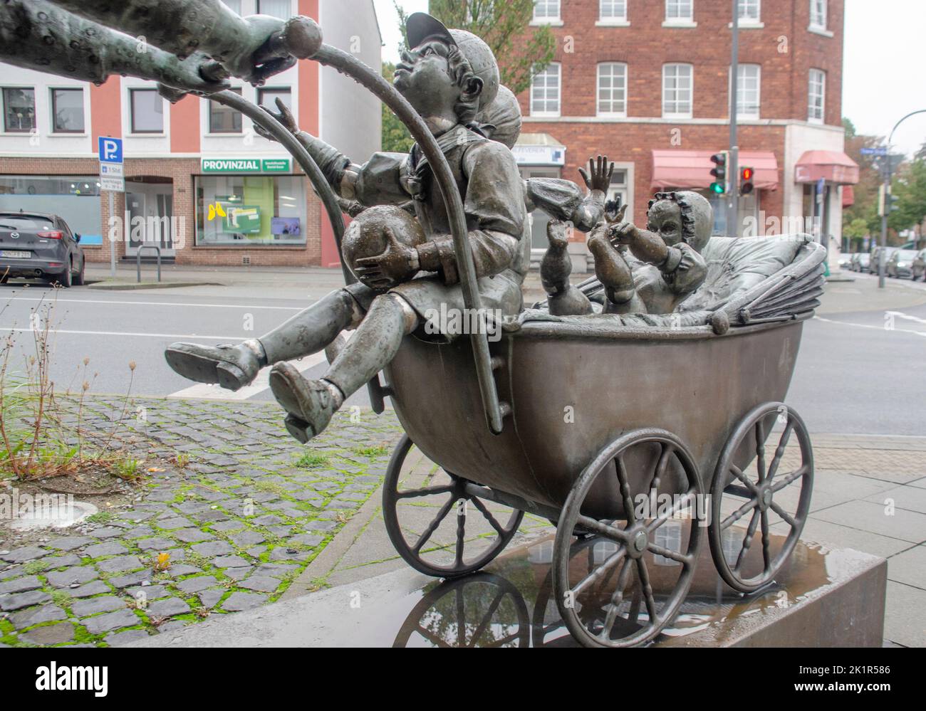 Aachen April 2021: A beautiful sculpture in the Aachen-Brand district. with child and cone. From bronze sculpture is the Aachen Bonifatius Stirnberg Stock Photo