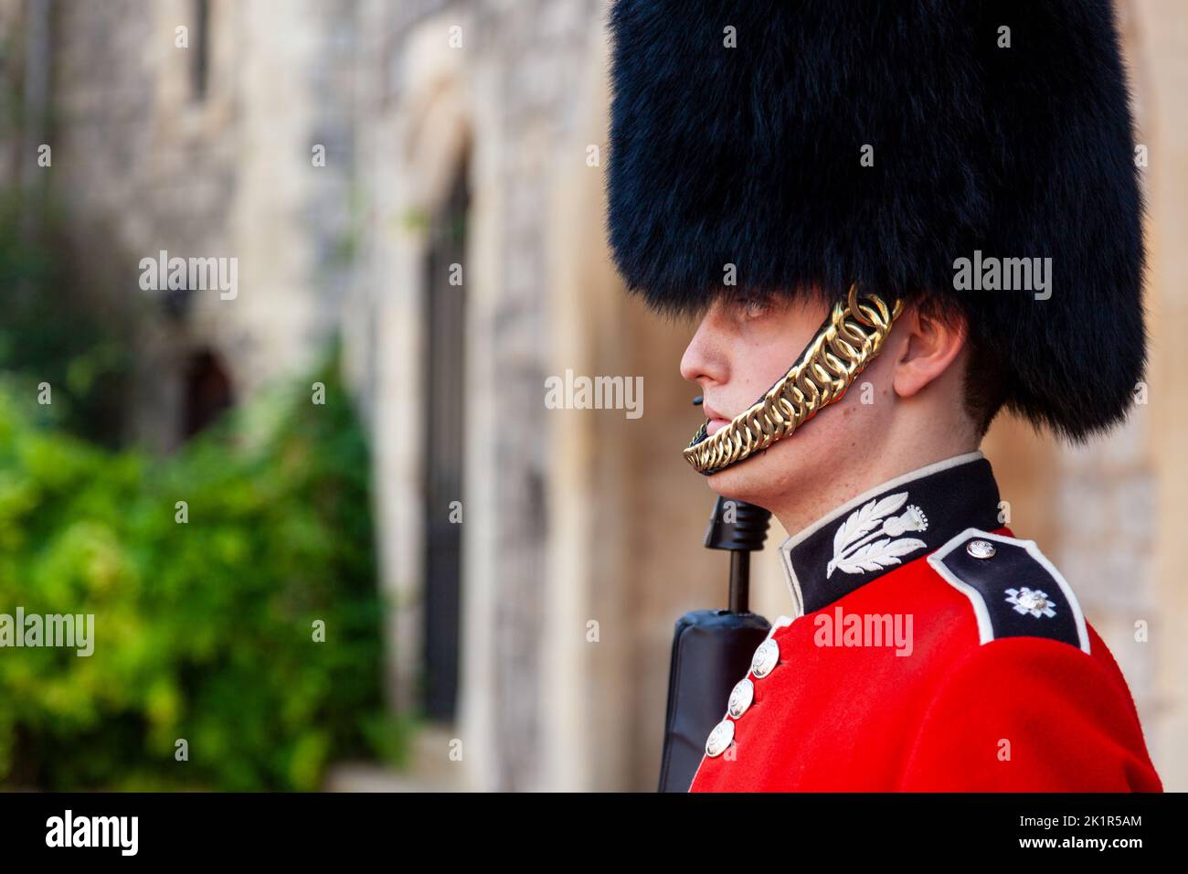WINDSOR, ENGLAND, 15 SEPTEMBER 2012. Scots Guards Guardsman soldier on sentry duty outside Windsor Castle, Berkshire, United Kingdom Stock Photo