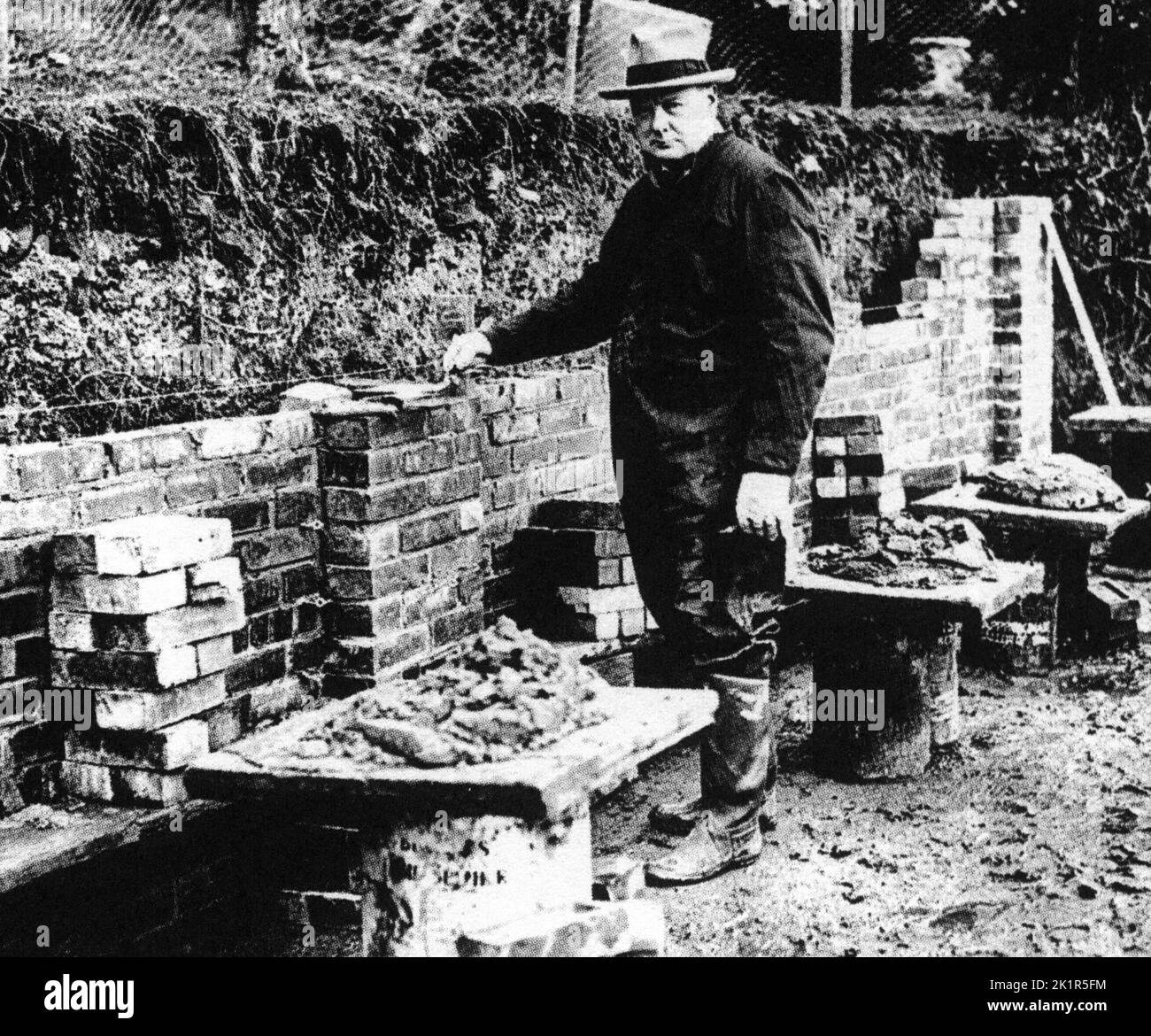 Winston Churchill bricklaying a wall at Chartwell 1928 Stock Photo