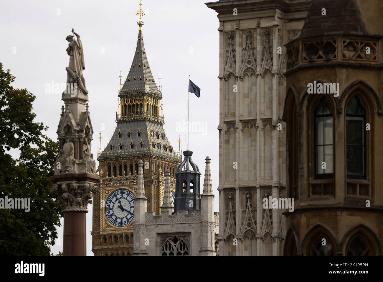 A flag flutters at full mast, following the funeral of Britain's Queen Elizabeth, over Westmisnter Abbey in London, Britain September 20, 2022. REUTERS/Tom Nicholson Stock Photo