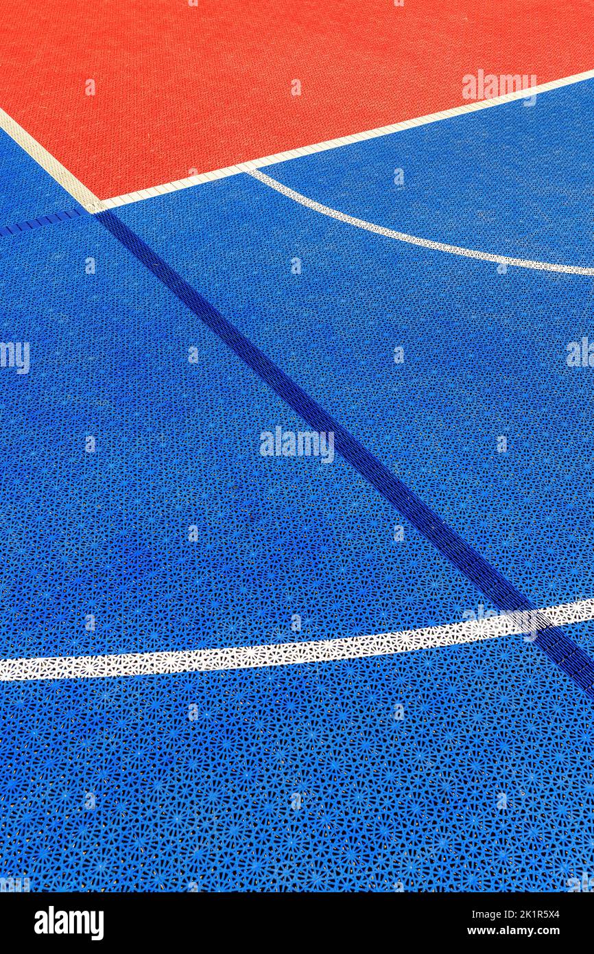 Outdoor basketball court plastic flooring tile detail, selective focus Stock Photo