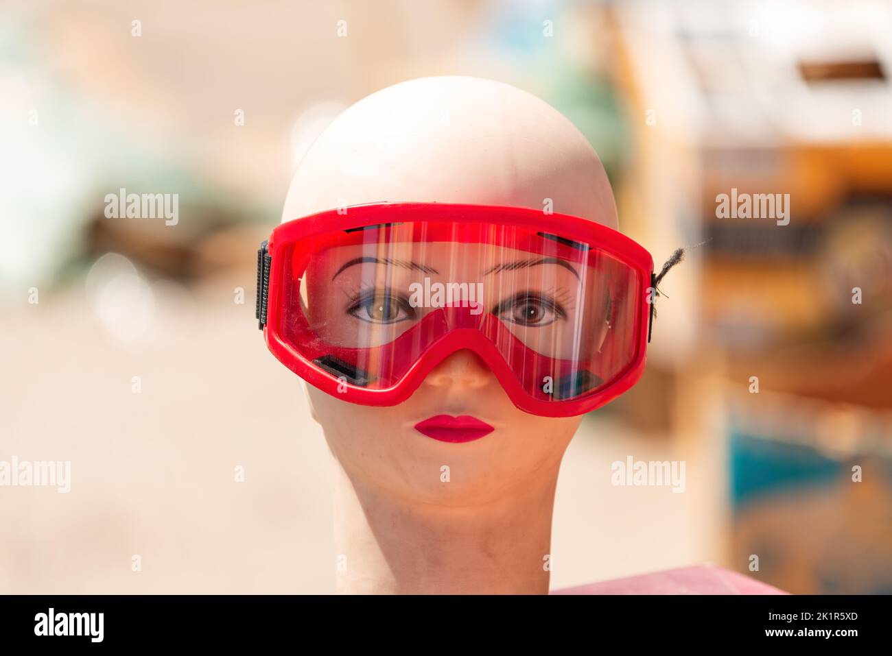 Mannequin head for protective safety eyewear on traditional street market festival, selective focus Stock Photo