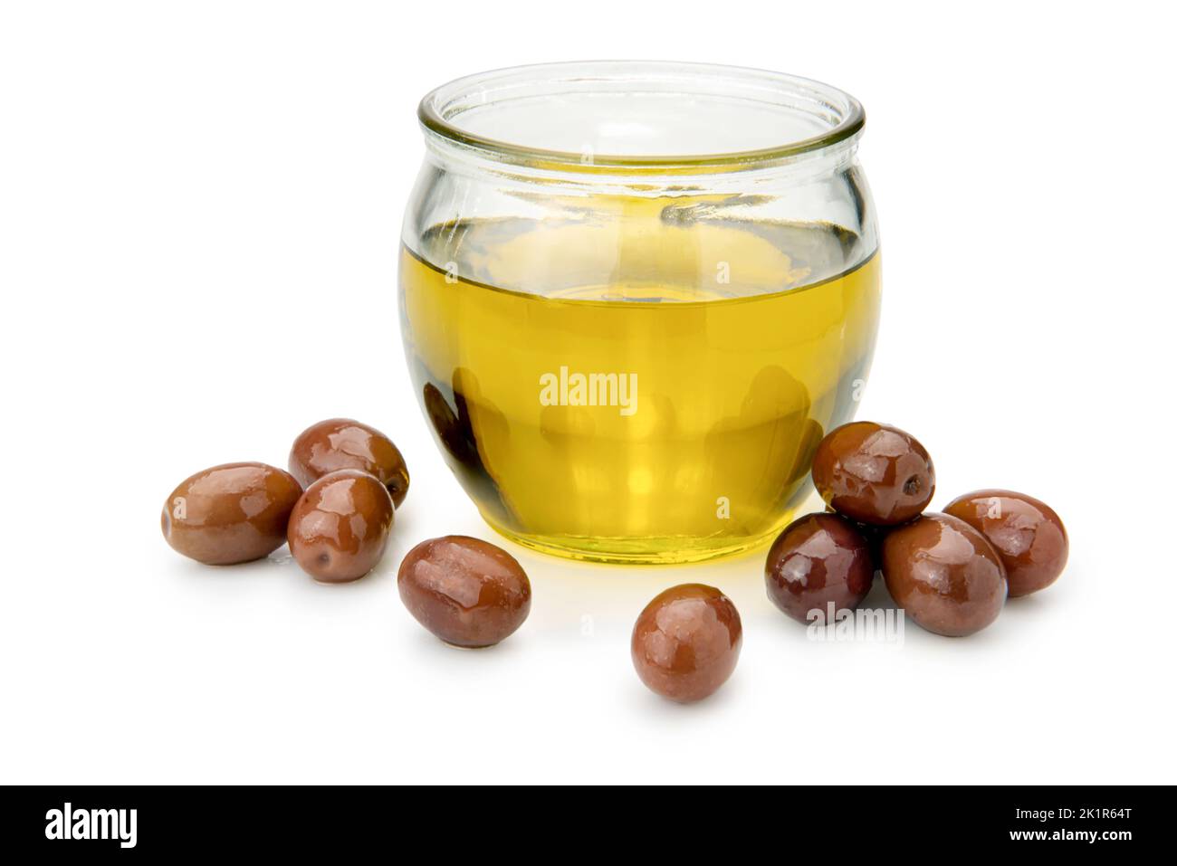 Extra virgin olive oil in a glass bowl with olives isolated on white ...