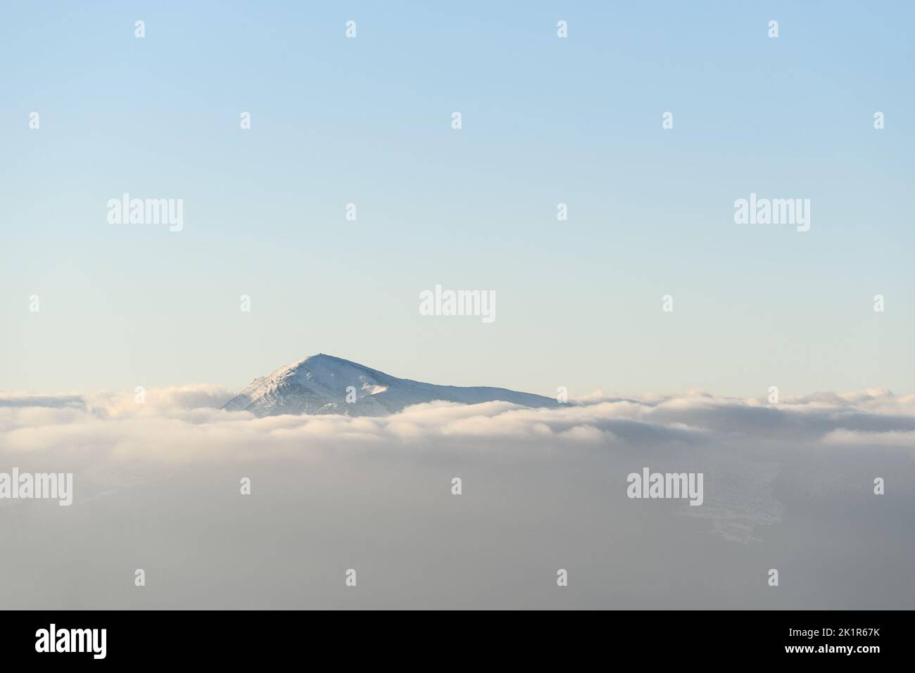 Top of Mount Hoverla in the Ukrainian mountains Carpathians with morning fog in the valley Stock Photo