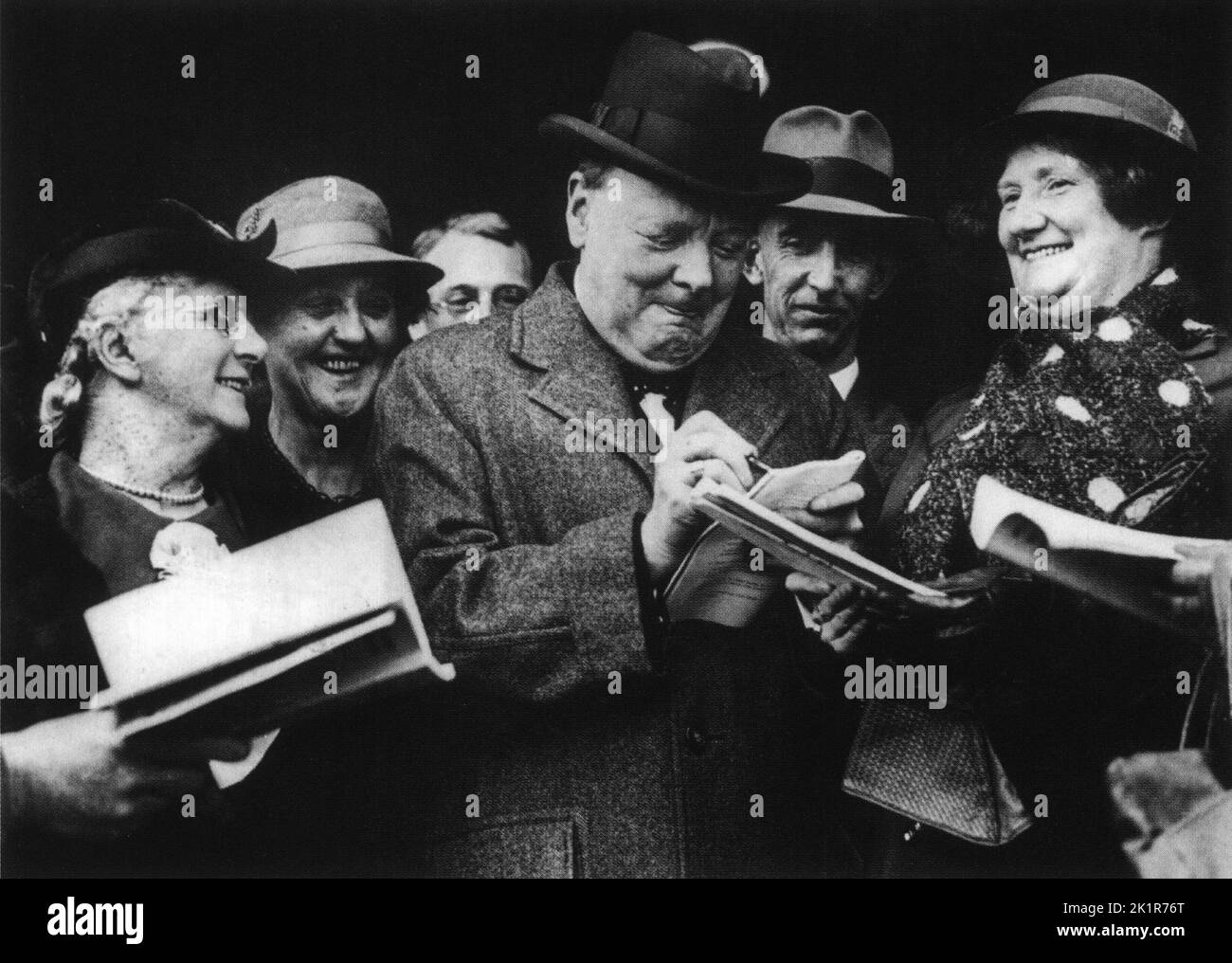 Winston Churchill signing autographs at Conservative Party Conference. October 1937 Stock Photo