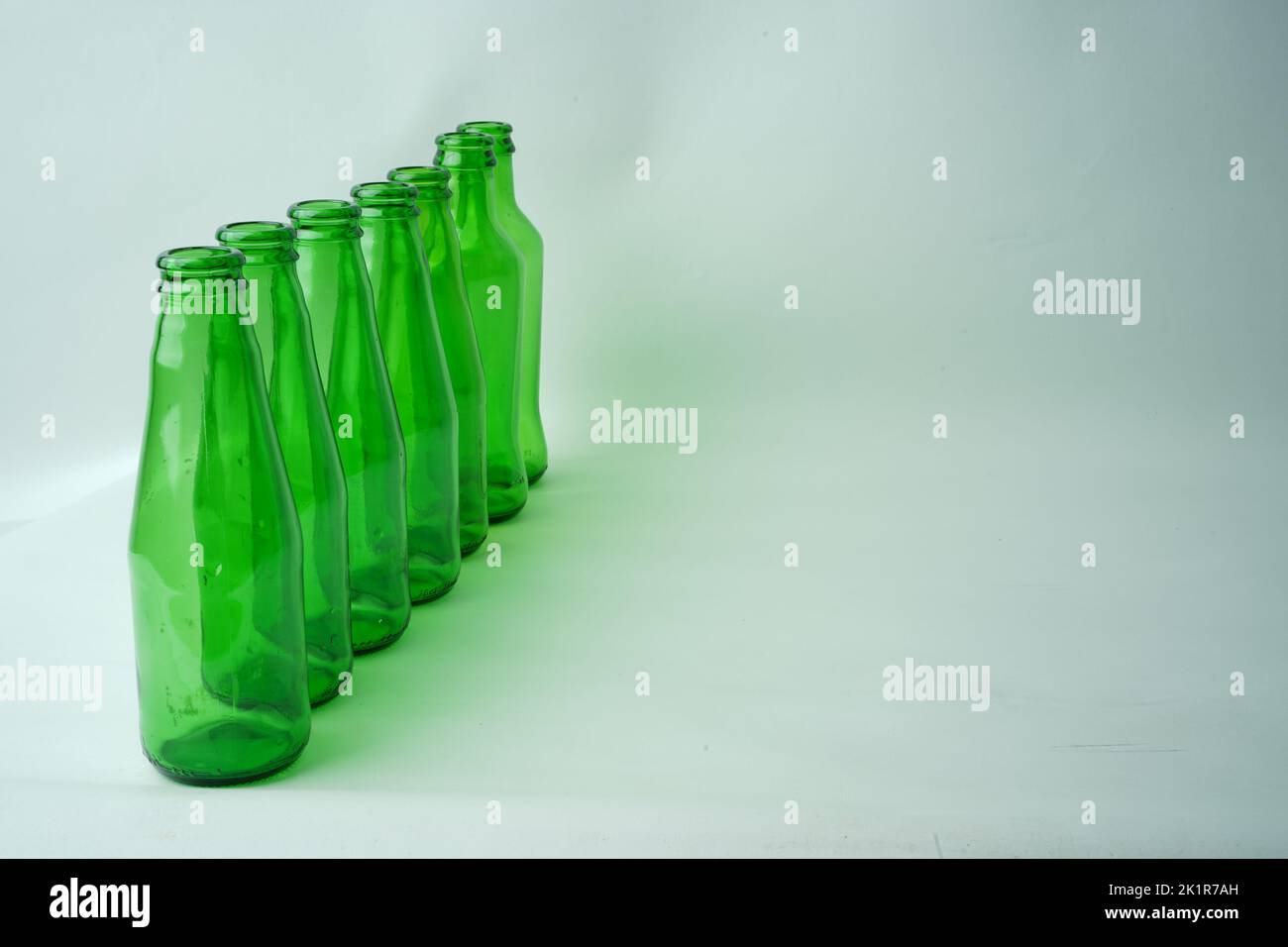 Glass bottles of soda on white background Stock Photo - Alamy