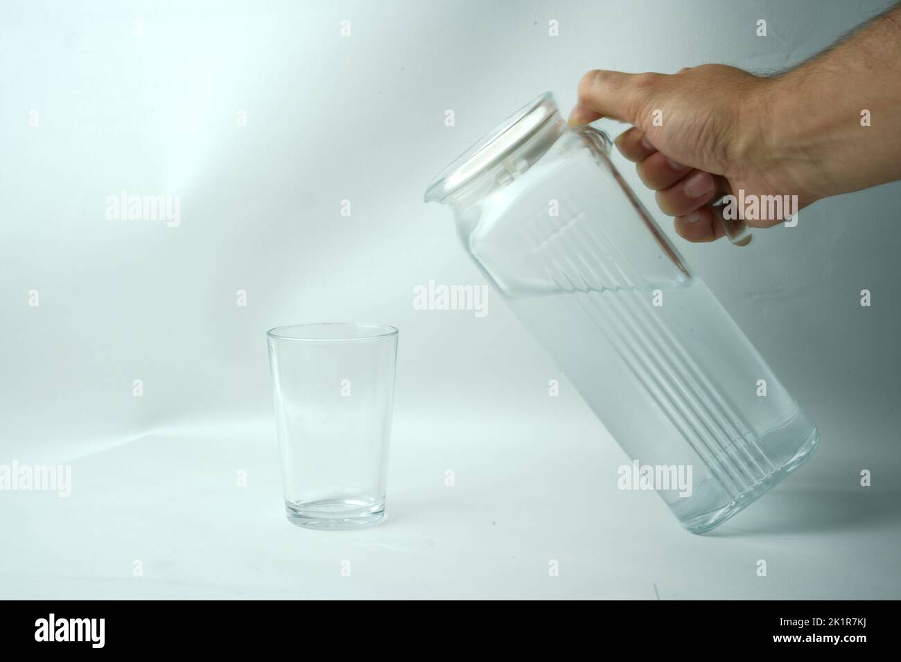 A carafe of clean water and a glass-glass and wather bottle Stock Photo