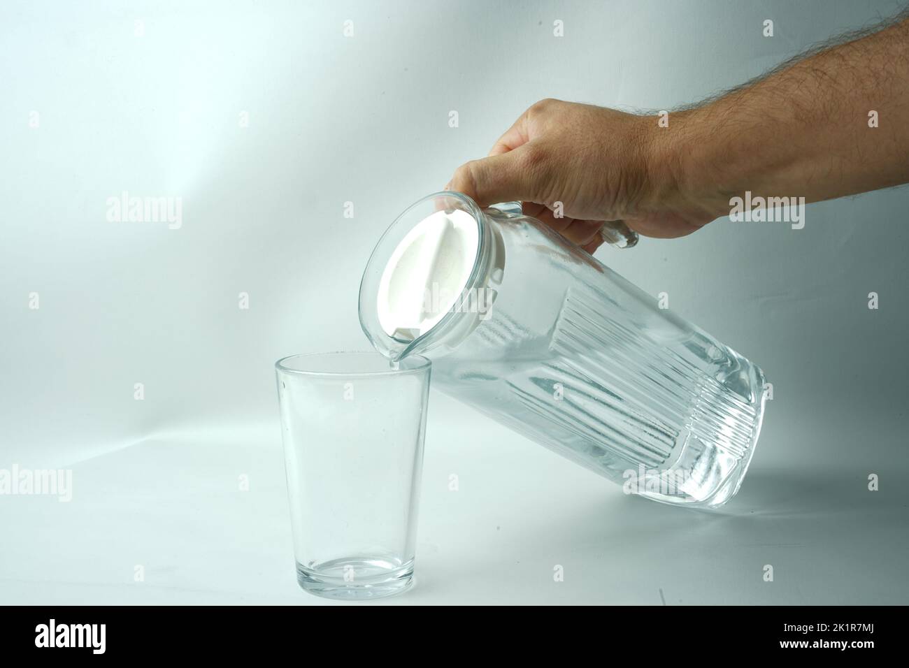 A carafe of clean water and a glass-glass and wather bottle Stock Photo