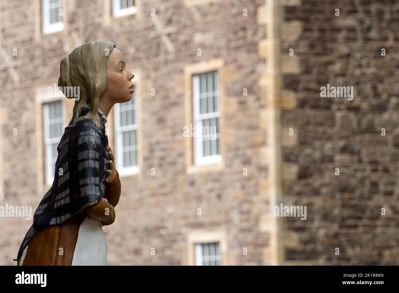 Figure of a mill spinner girl at the UNESCO World Heritage site of New Lanark, Scotland, UK Stock Photo