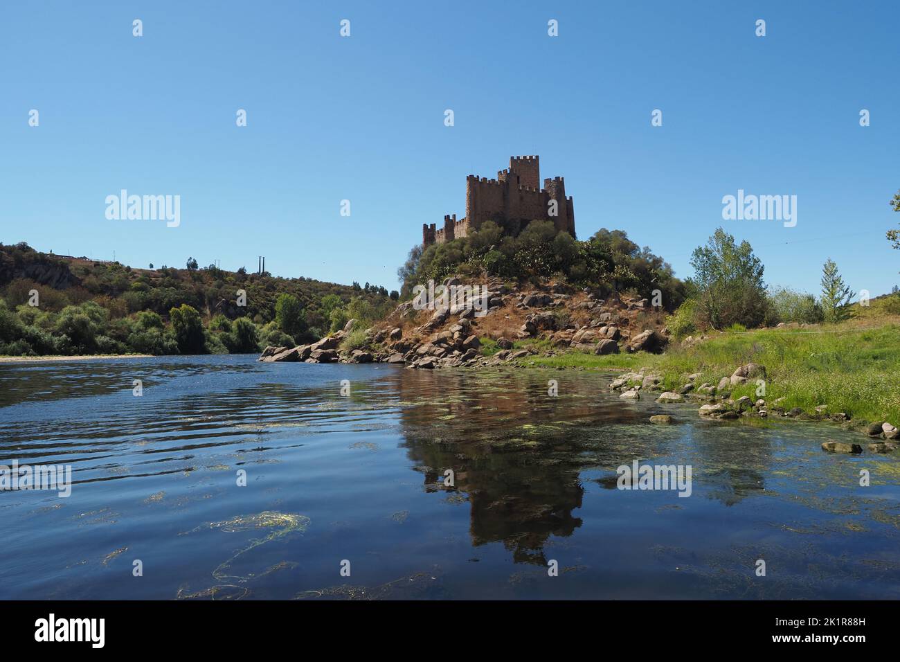 Remains of a Medieval castle of Almourol or Castelo de Almourol on a hill next to Tagus river in the Praia do Ribatejo, Portugal, Santarém district. Stock Photo