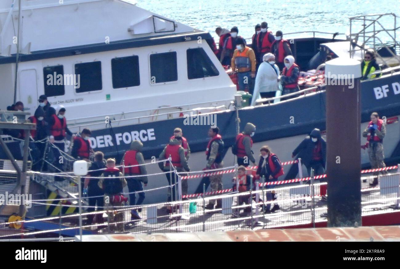 A group of people thought to be migrants are brought in to Dover, Kent, from a Border Force vessel following a small boat incident in the Channel. Picture date: Tuesday September 20, 2022. Stock Photo