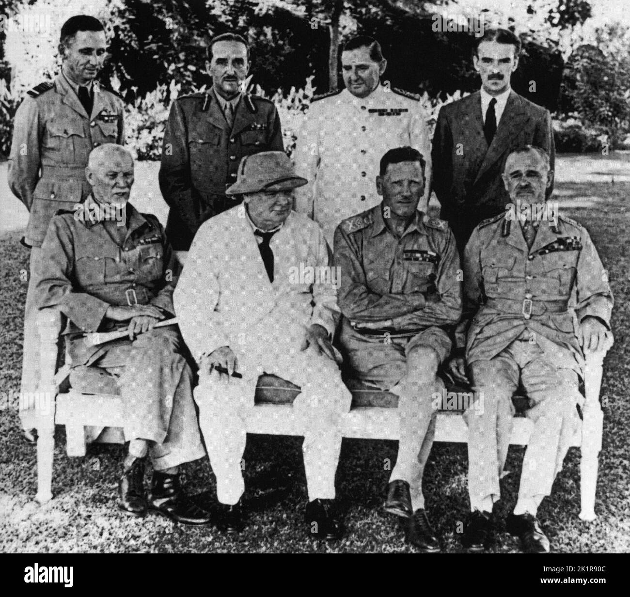 Winston Churchill at the British Embassy, 1942 Cairo. Top: Tedder, Brooke, Harwood and Casey. Bottom: Smuts, WSC, Auchinleck and Wavell. Stock Photo