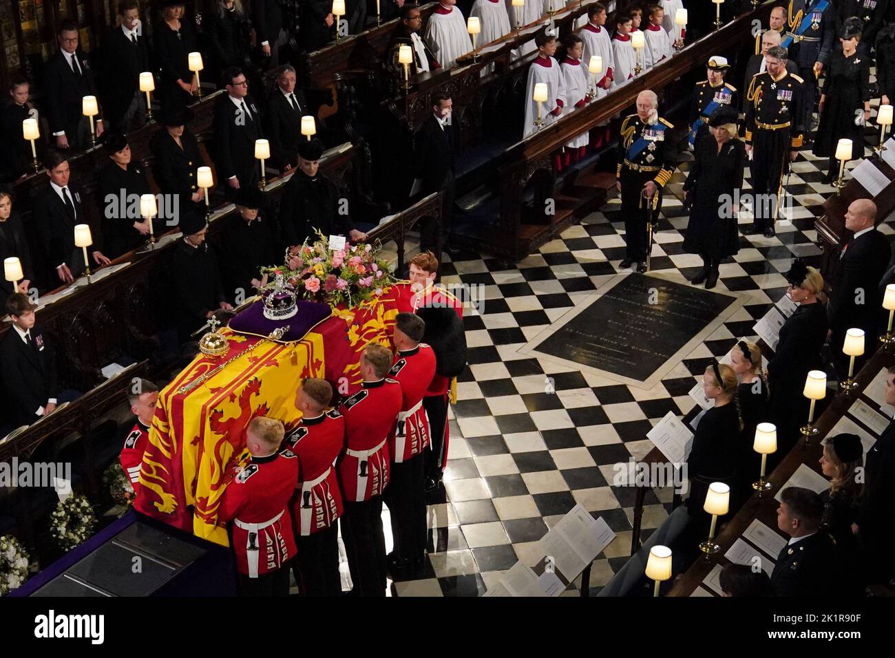 The coffin of Queen Elizabeth II, followed by (left to right, from front) King Charles III, the Queen Consort, the Princess Royal, Vice Admiral Sir Tim Laurence, the Duke of York, the Earl of Wessex and the Countess of Wessex, is carried by the Bearer Party into the Committal Service for Queen Elizabeth II held at St George's Chapel in Windsor Castle, Berkshire. Picture date: Monday September 19, 2022. Stock Photo