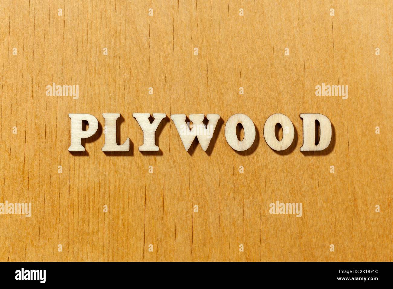Word 'Plywood' by wooden letters close up Stock Photo