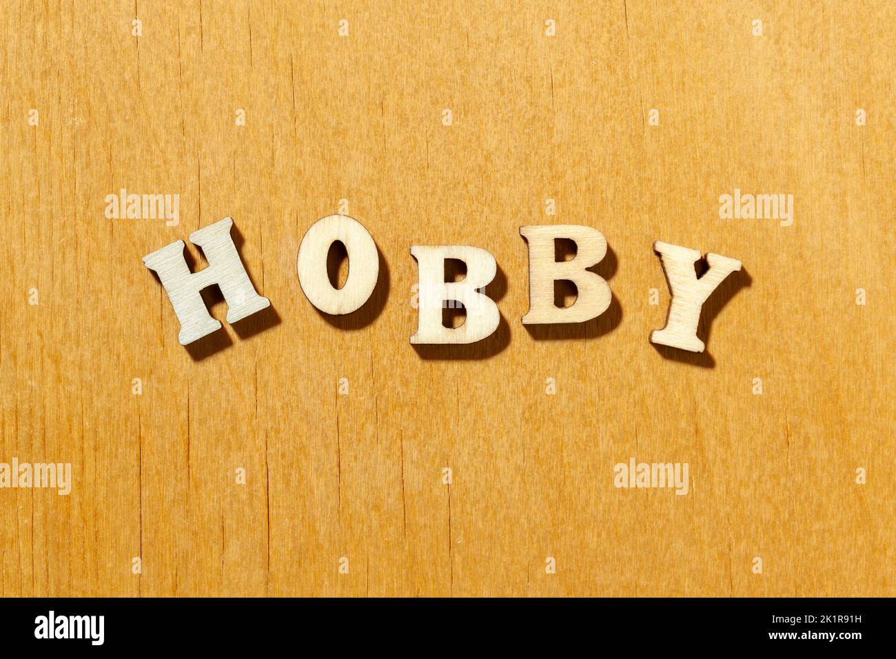 Word 'Hobby' by wooden letters close up Stock Photo