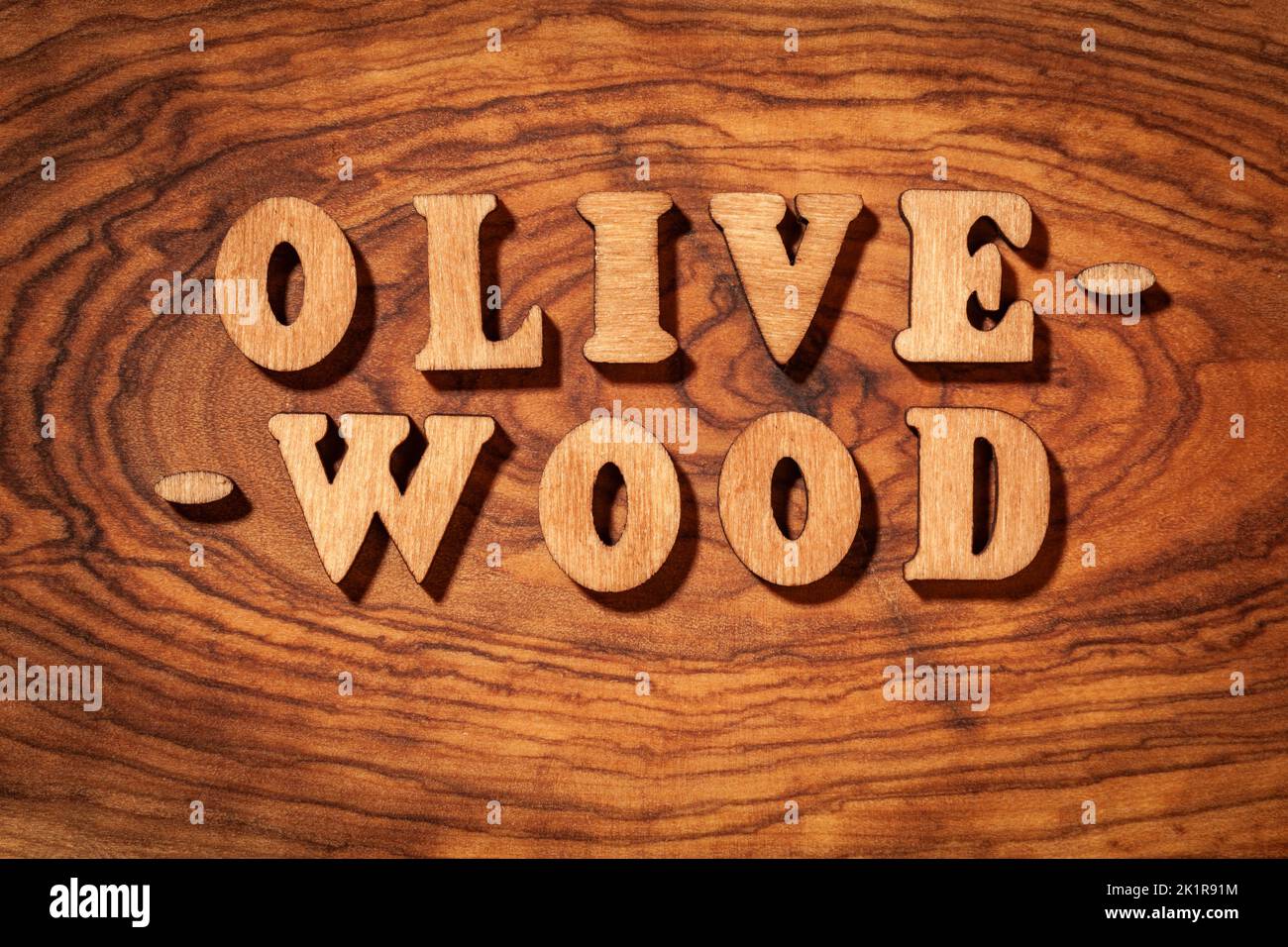 Olive-wood - Inscription by wooden letters close up Stock Photo