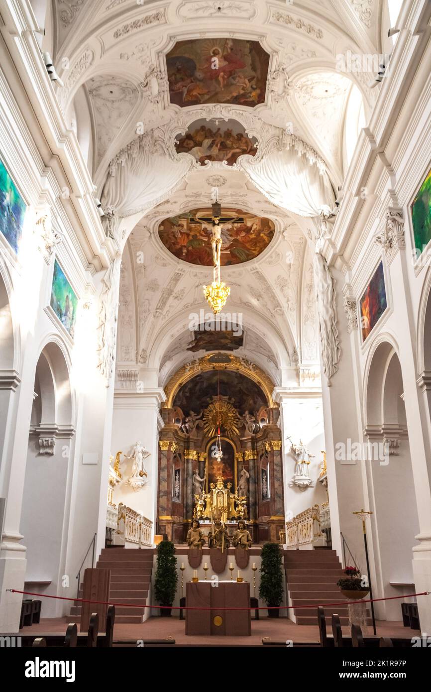 Great view of the choir and the altar apse that are elevated above the east crypt inside the famous Neumünster Collegiate church in Würzburg, Germany. Stock Photo