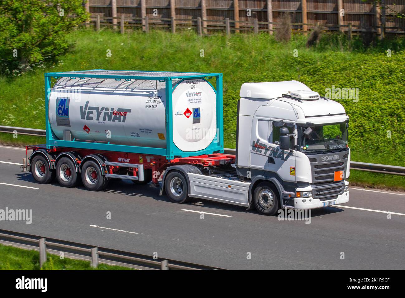 Transports Veynat, French liquid foods trucking freight HGV haulage company; Haulage delivery trucks, lorry, heavy-duty vehicles, transportation, truck, cargo carrier, vehicle, European commercial transport industry HGV, M6 at Manchester, UK Stock Photo