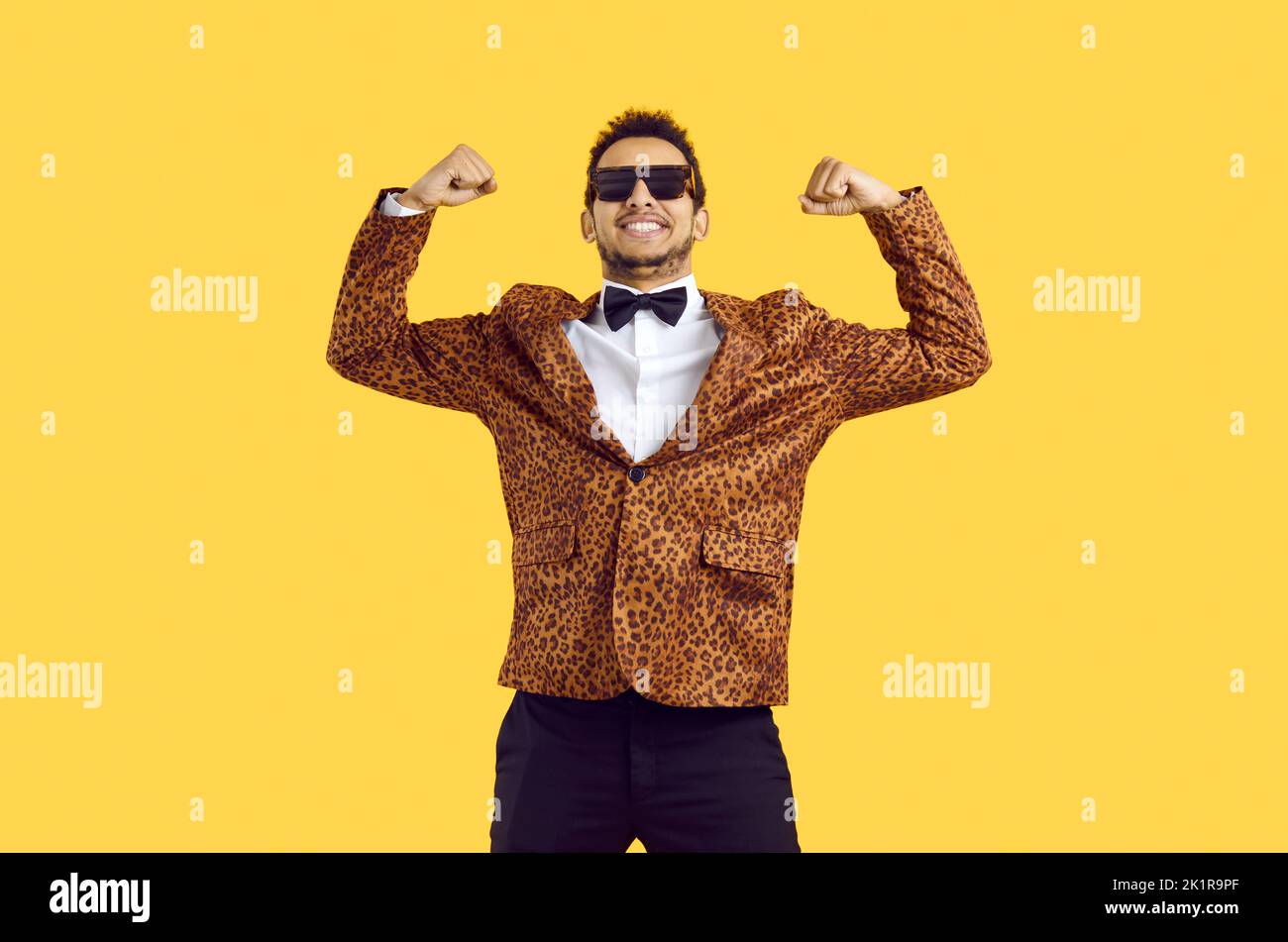 Happy black man in print jacket show muscles Stock Photo