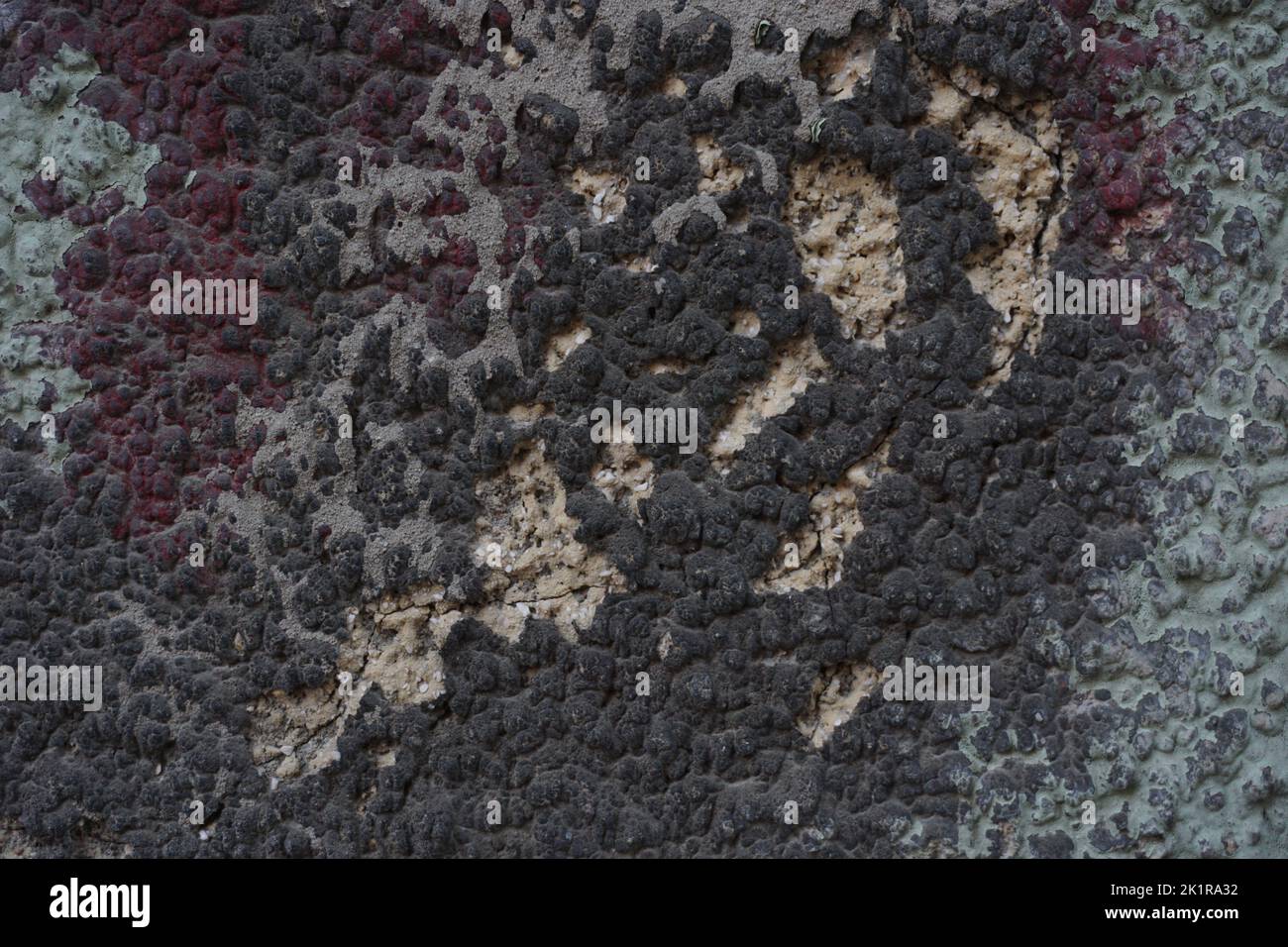 Cracked wall with old layers of paint, copy space Stock Photo