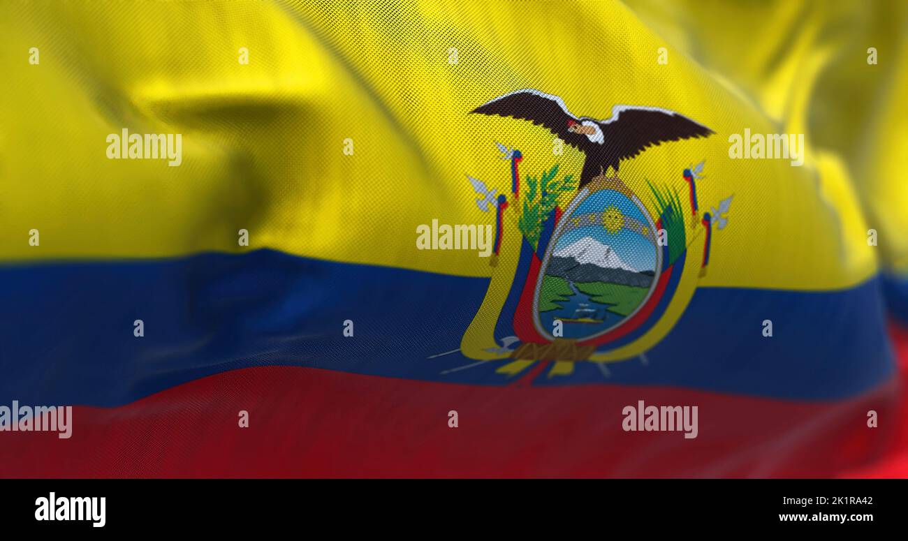 Close-up view of the Ecuador national flag waving in the wind. The Republic of Ecuador is a country in northwestern South America. Fabric textured bac Stock Photo