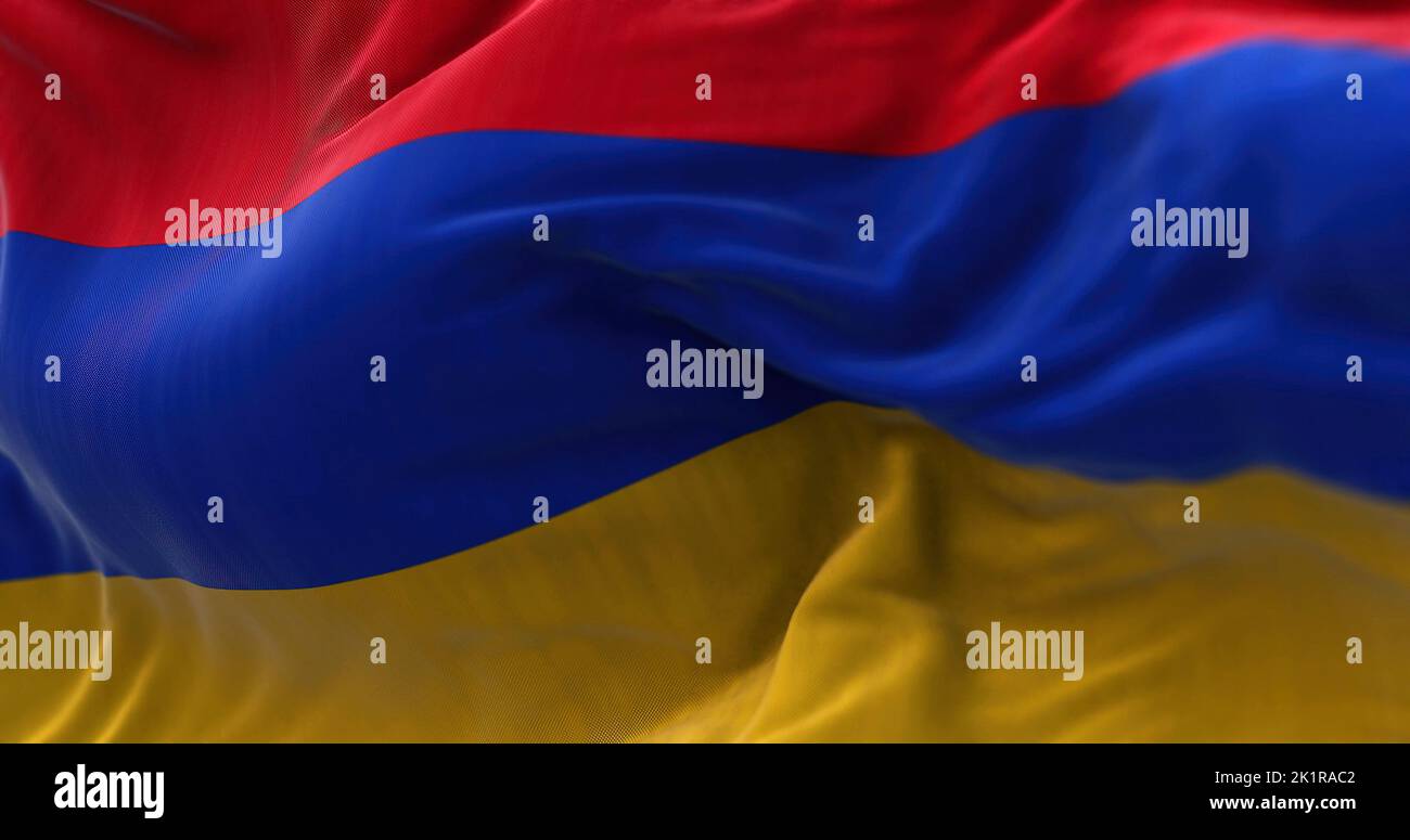 Close-up view of the armenian national flag waving in the wind. Armenia is a landlocked country located in the Armenian Highlands of Western Asia. Fab Stock Photo