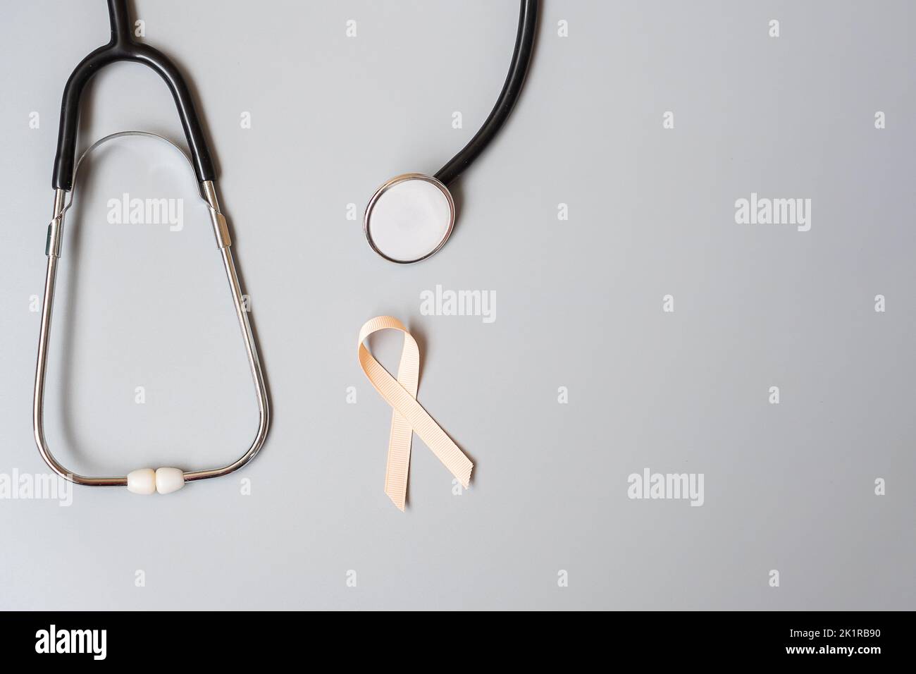 September Uterine Cancer Awareness month, Peach Ribbon with stethoscope ...