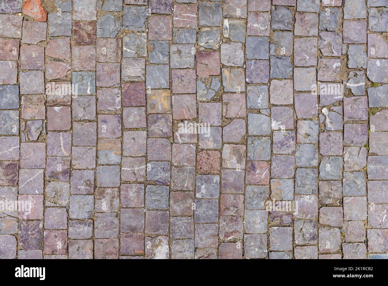 Stone pavement texture. Granite cobblestoned pavement background. Stock Photo